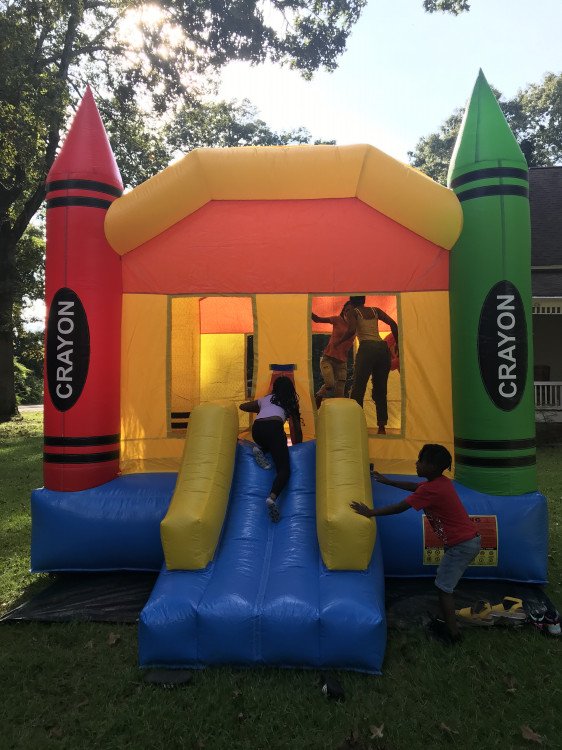 kids inside a crayon bounce house