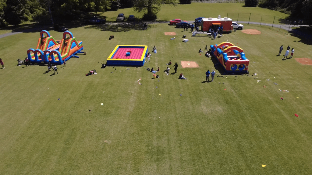 Large inflatable rentals setup at an outdoor Atlanta community event